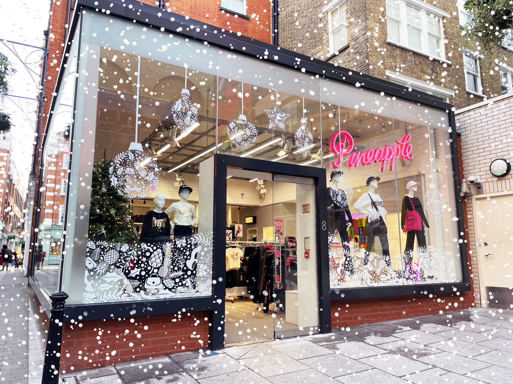 Pineapple fashion store in new Christmas look, festive decorations in Covent Garden.