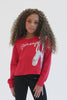 Skylar Blu wearing ballet Christmas sweater designed by Pineapple Dance Studios.